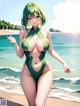 A woman in a green bathing suit standing on a beach.